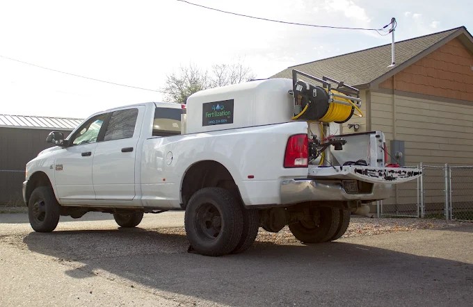 White truck that says 406 Fertilization